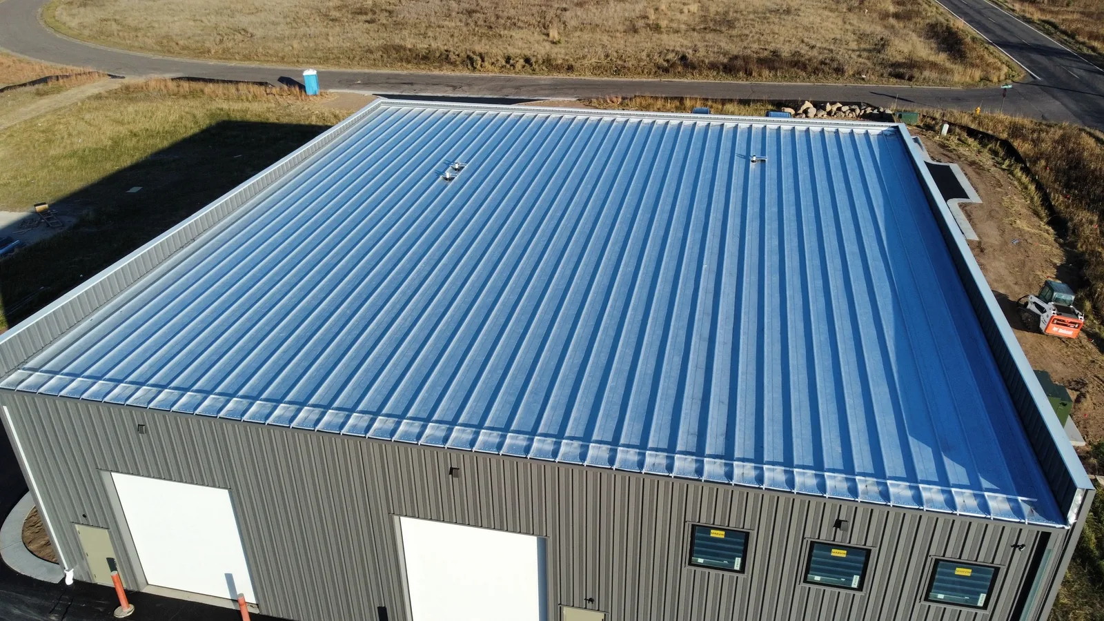 Collins Roofing — commercial standing seam install in Cloquet, MN