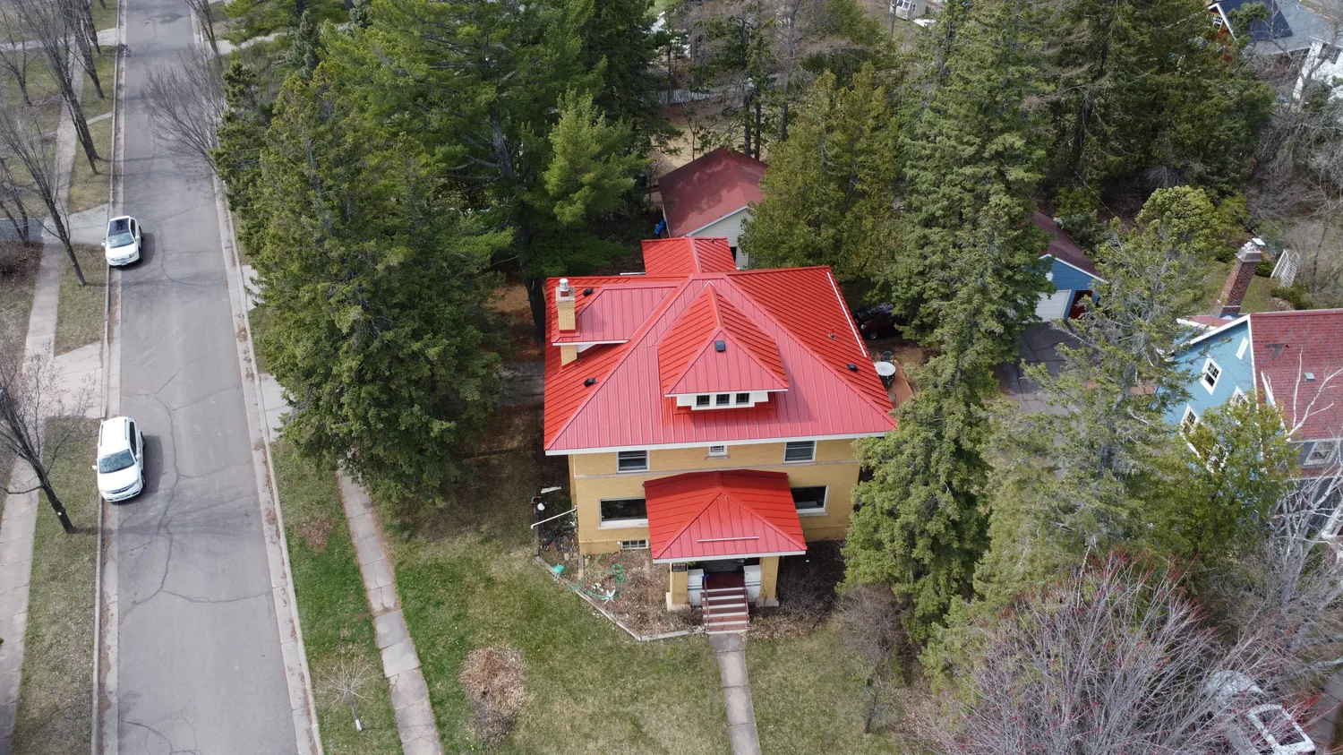Collins Roofing — red metal roof install in Rochester, MN