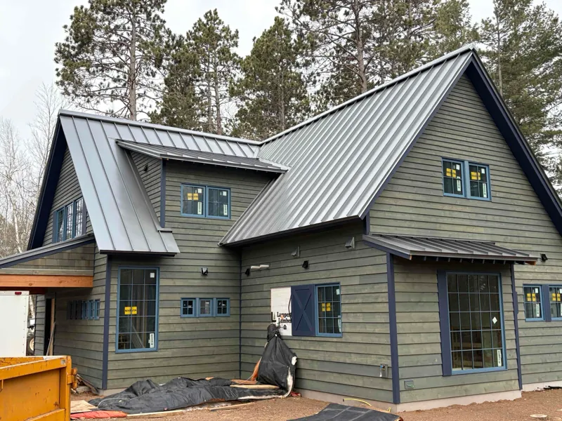 Collins Roofing — charcoal metal roof install in Hayward, WI